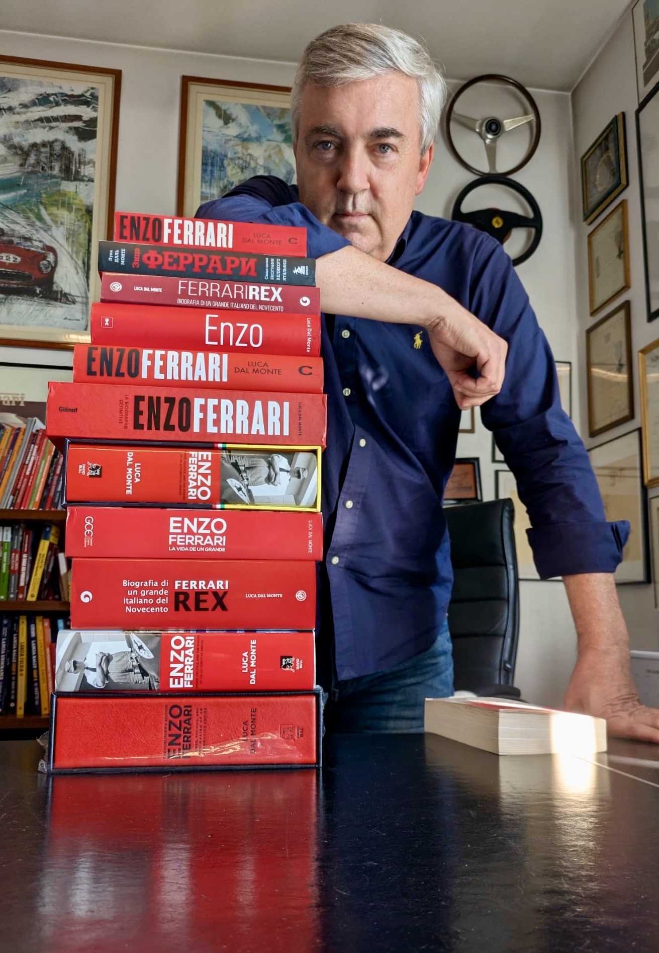 Luca Dal Monte with a stack of the international editions of Ferrari Rex